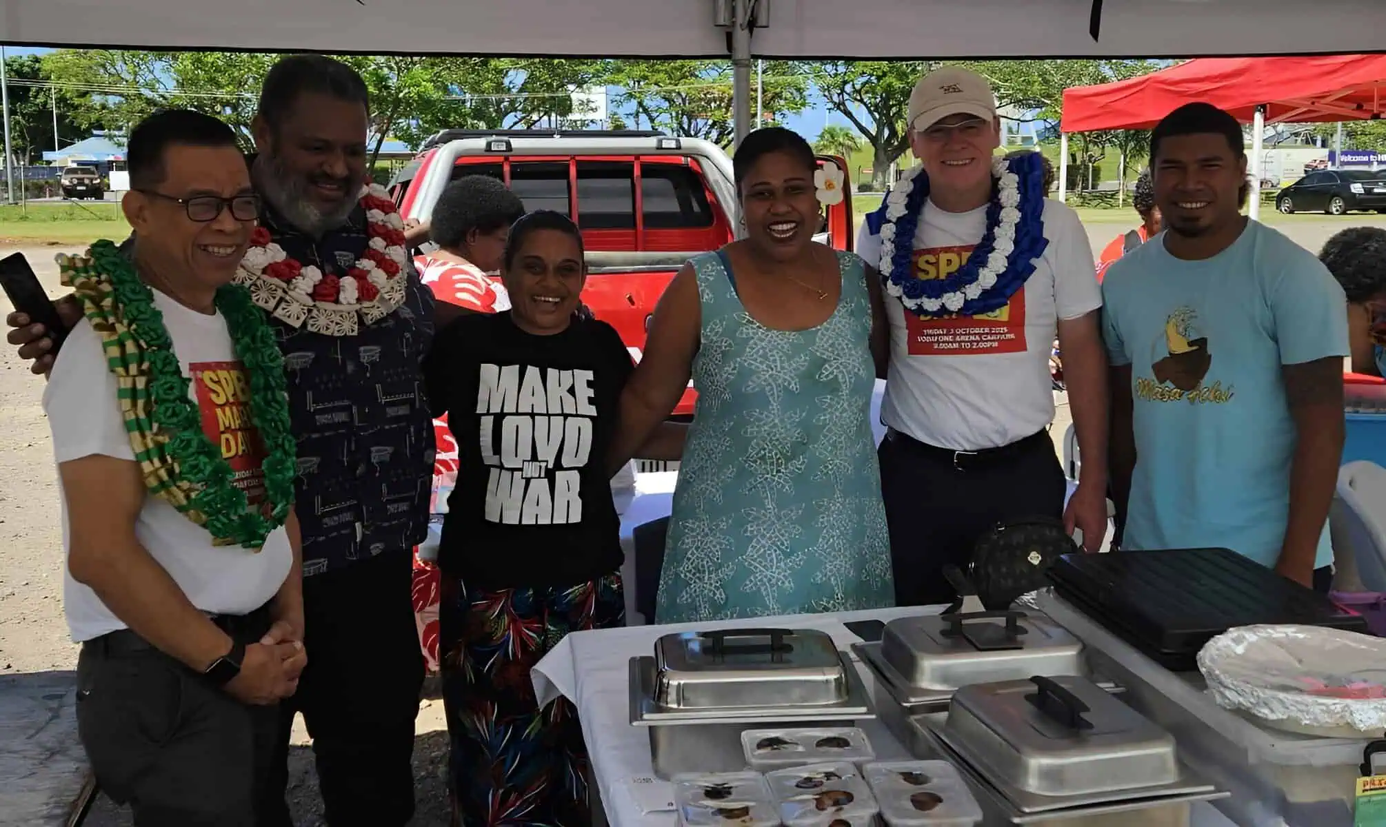SPBD Founder Gregory Casagrande with women entrepreneurs at the SPBD market day in Suva.